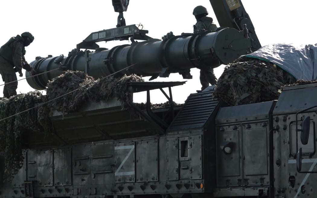 In this photo released by Russian Defense Ministry Press Service on Tuesday, May 21, 2024, Russian troops load an Iskander missile as part of drills to train the military for using tactical nuclear weapons at an undisclosed location in Russia. Russia's Defense Ministry on Tuesday said it began the first round of drills involving tactical nuclear weapons. It was the first time Russia has publicly announced drills involving tactical nuclear weapons, although its strategic nuclear forces regularly hold exercises. (Russian Defense Ministry Press Service via AP)