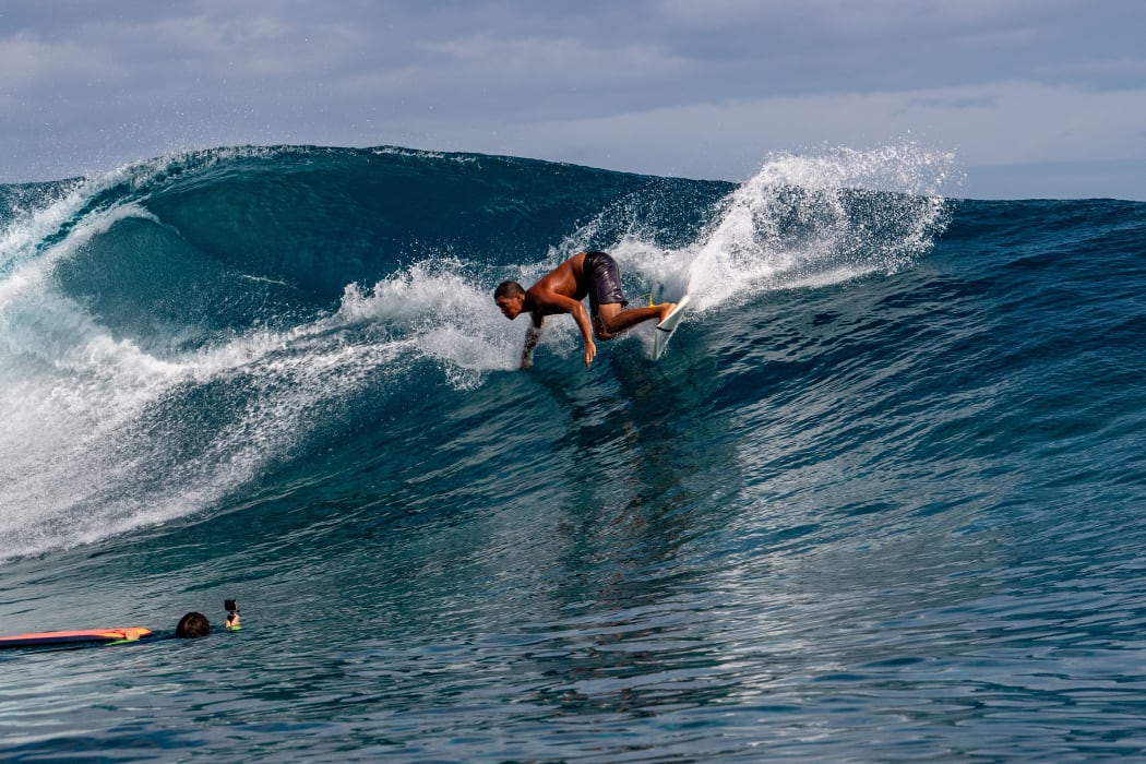 A Surfer training days out from Billabong's annual Tahiti competition at Teahupoo reef. TAHITI, FRENCH POLYNESIA - AUGUST 5 2018