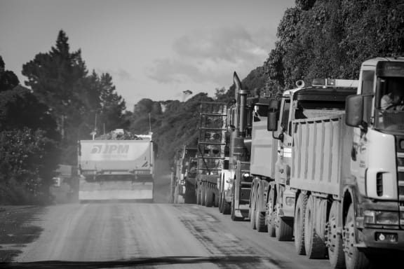 Hundreds of trucks and heavy machinery line the road along the coast. SH1 north of Kaikoura is due to open on December 15th.