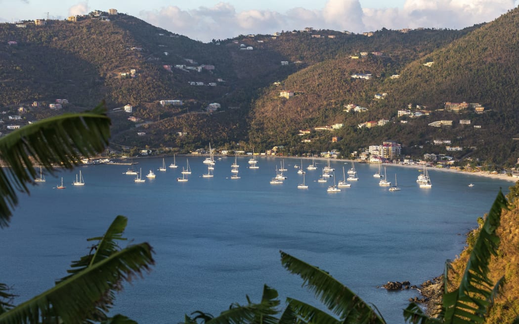 West Indies, British Virgin Islands, Tortola Island, in the Bay of Cane Garden sailboats at anchor, on the mountains some houses (Photo by LIOT Jean-Marie / hemis.fr / hemis.fr / Hemis via AFP)