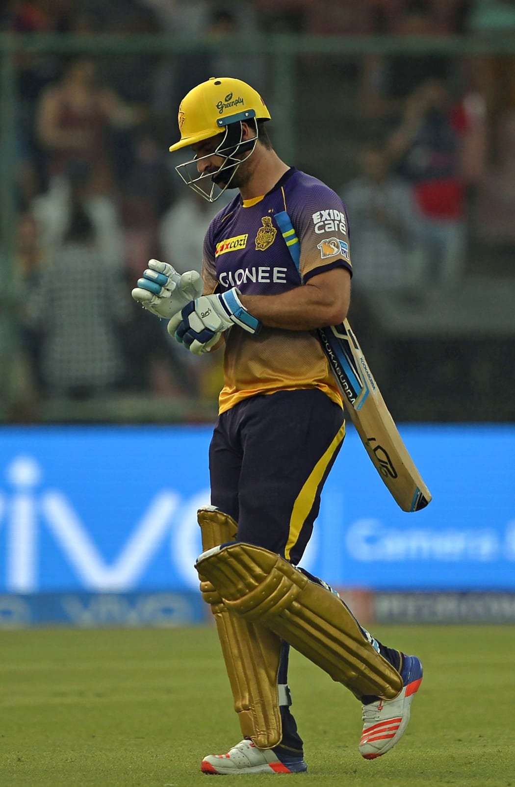 Colin de Grandhomme trudges off the field.