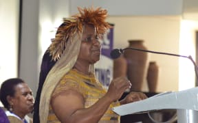 West Papuan human rights activist Rode Wanimbo address the 7th Pacific Women's Network Against Violence Against Women, while Bernadetha Mahuse looks on.
