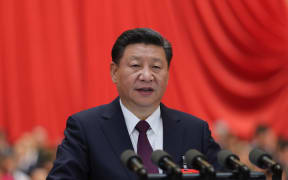 Xi Jinping delivers a report to the 19th National Congress of the Communist Party of China on behalf of the 18th Central Committee at the Great Hall of the People in Beijing.
