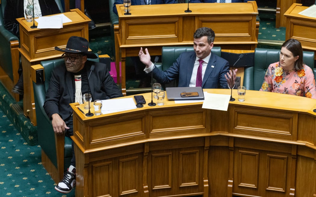 ACT Leader David Seymour reacts after the Speaker turns down his complaint against Rawiri Waititi. Waititi ignores him.