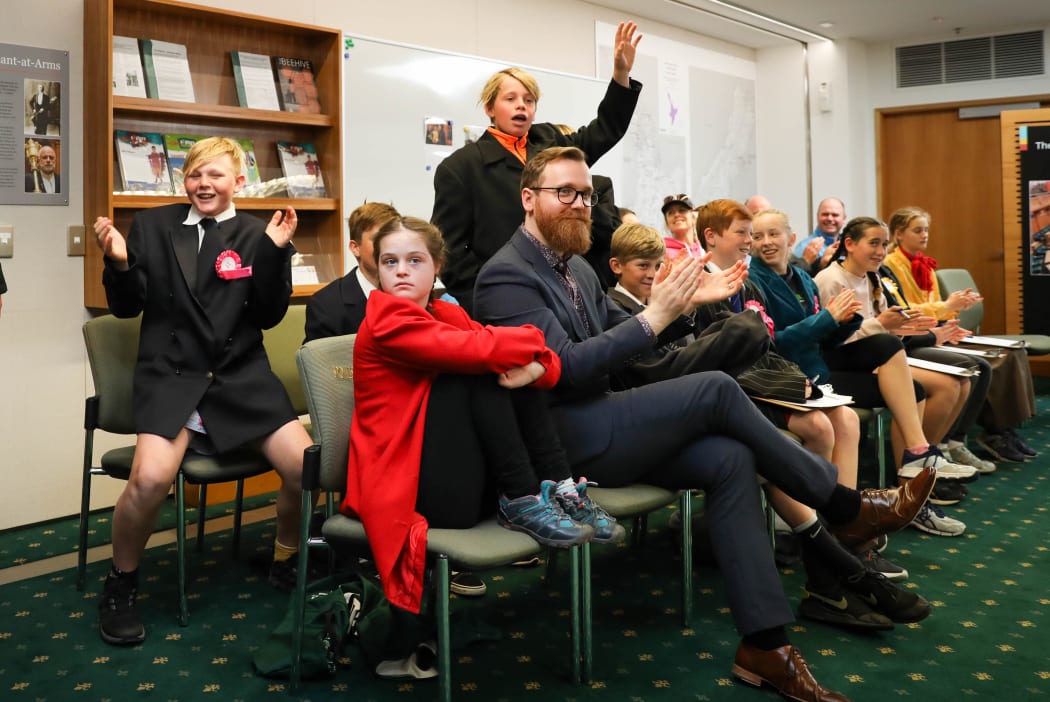 Parliamentary educator Ben Logan-Milne sits on the Mapua School opposition benches, where he has been coaching interjecting.