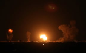 Explosion illuminates the night sky after Israeli warplanes hit several targets of Izz ad-Din al Qassam Brigades on September 16, 2020 in Khan Yunis, Gaza.