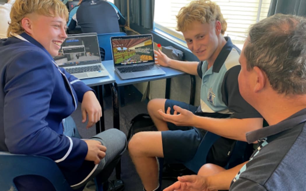 Napier Boys’ High School agricultural teacher Rex Newman discusses fruit harvesting with his students.
