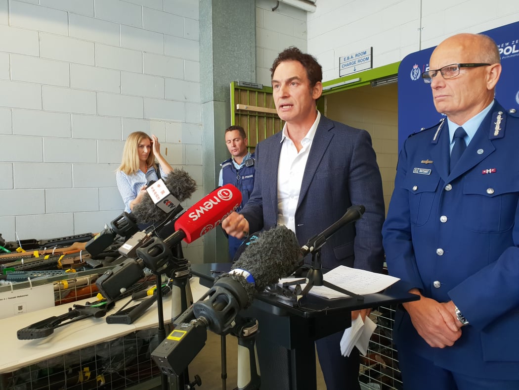 Police Minister Stuart Nash (third left) and Deputy Police Commissioner Mike Clement (right) at a media briefing held at the end of the gun buy-back scheme.