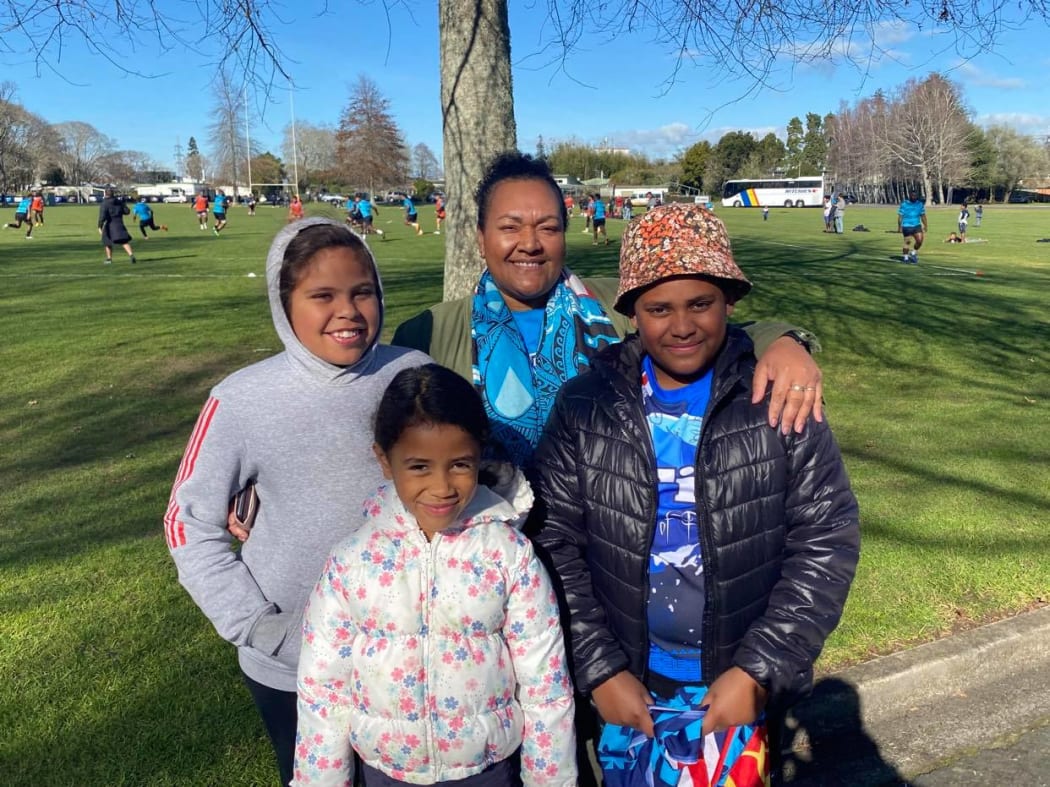 Clinical nurse specialist and Fiji rugby fan Savaira Vuidreketi with three of her children.