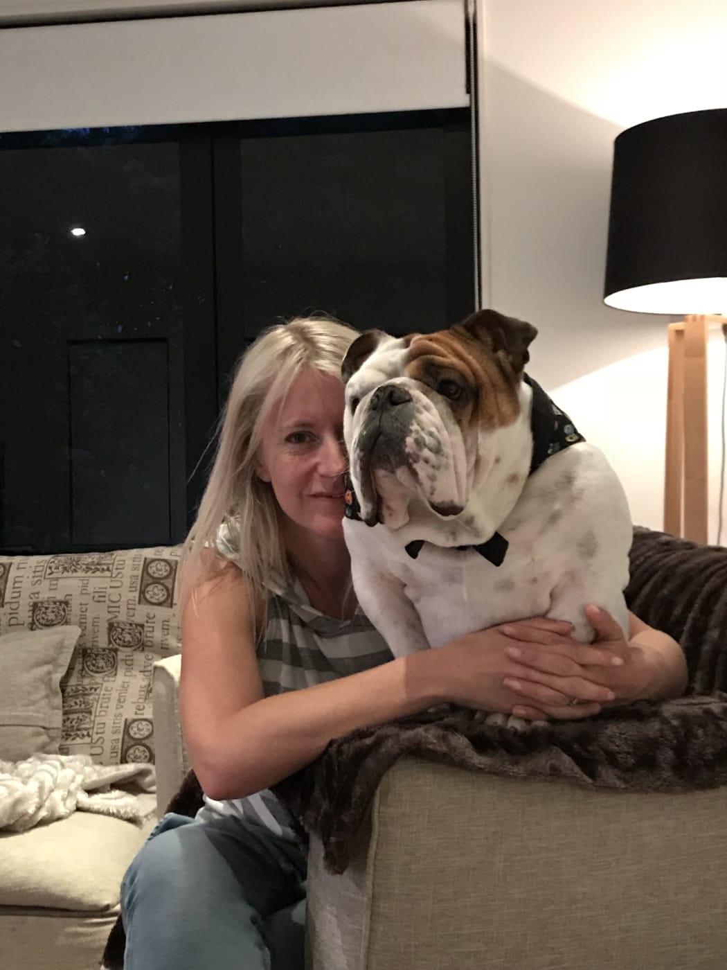 Natalie Newton, of Milford, Auckland, and 2-year-old bulldog Tank.
