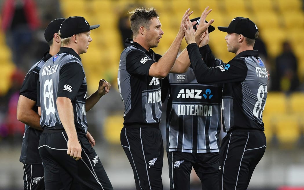 Tim Southee is congratulated by team-mates after taking a wicket against India in Wellington.