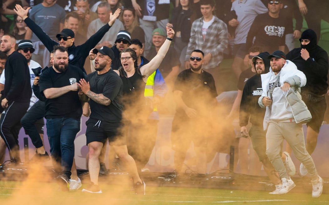 Melbourne Victory fans invade the pitch during the A-League Men's soccer match between Melbourne City and the Melbourne Victory at AAMI Park in Melbourne, Saturday, December 17, 2022. (AAP Image/Will Murray/ www.photosport.nz