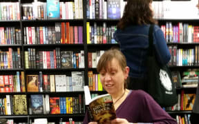 Karen McLeod reading Into the River in Wellington's Unity Book.