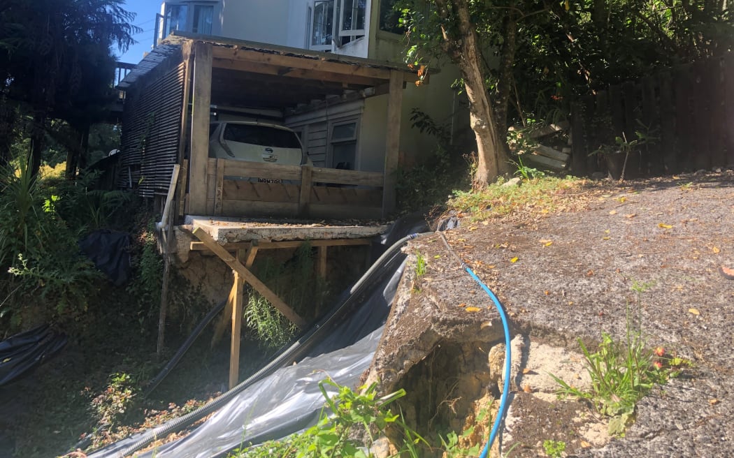Catherine Albiston's car has been stranded for more than a year after a council bank slid and took away her driveway.