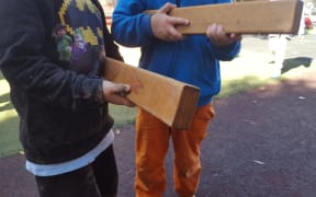Children using blocks as toy guns.