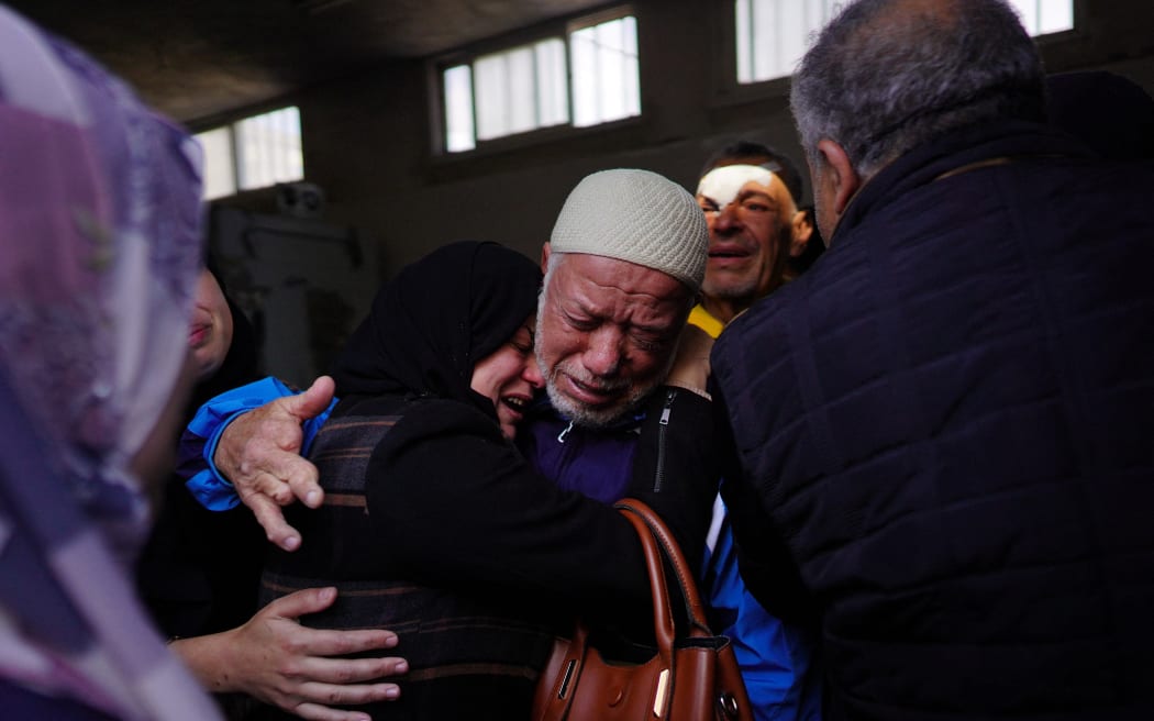 Palestinians mourn their relatives, killed in overnight Israeli bombardment, at Al-Aqsa Martyrs Hospital in Deir al-Balah on March 25, 2024, amid the ongoing conflict between Israel and the Palestinian militant group Hamas. (Photo by AFP)