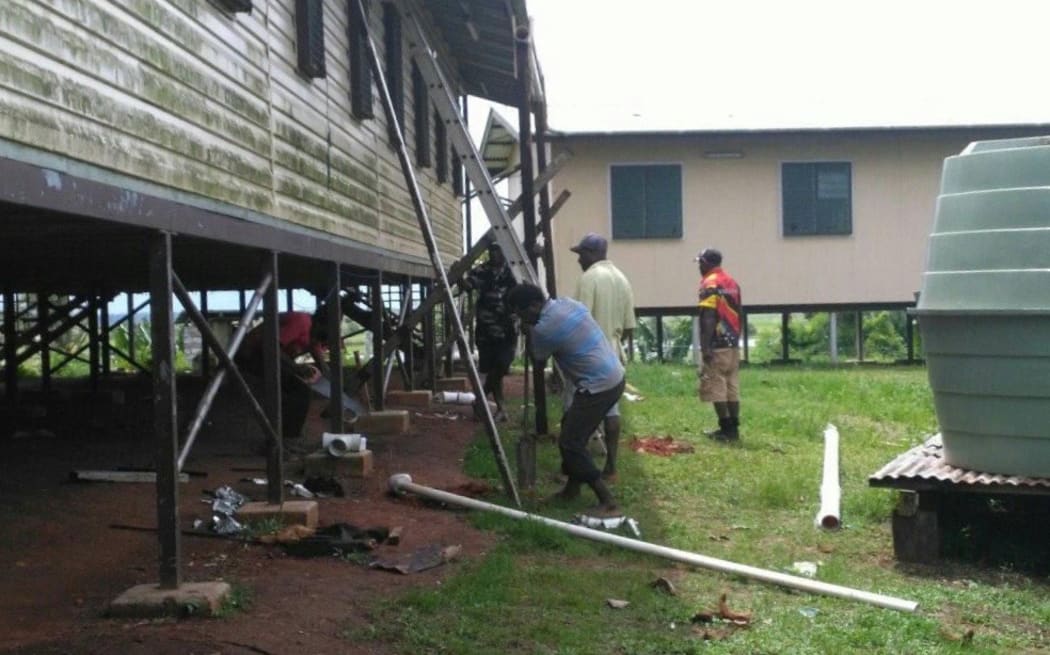 Rain water tanks being connected to bathrooms at Awaba Secondary School.