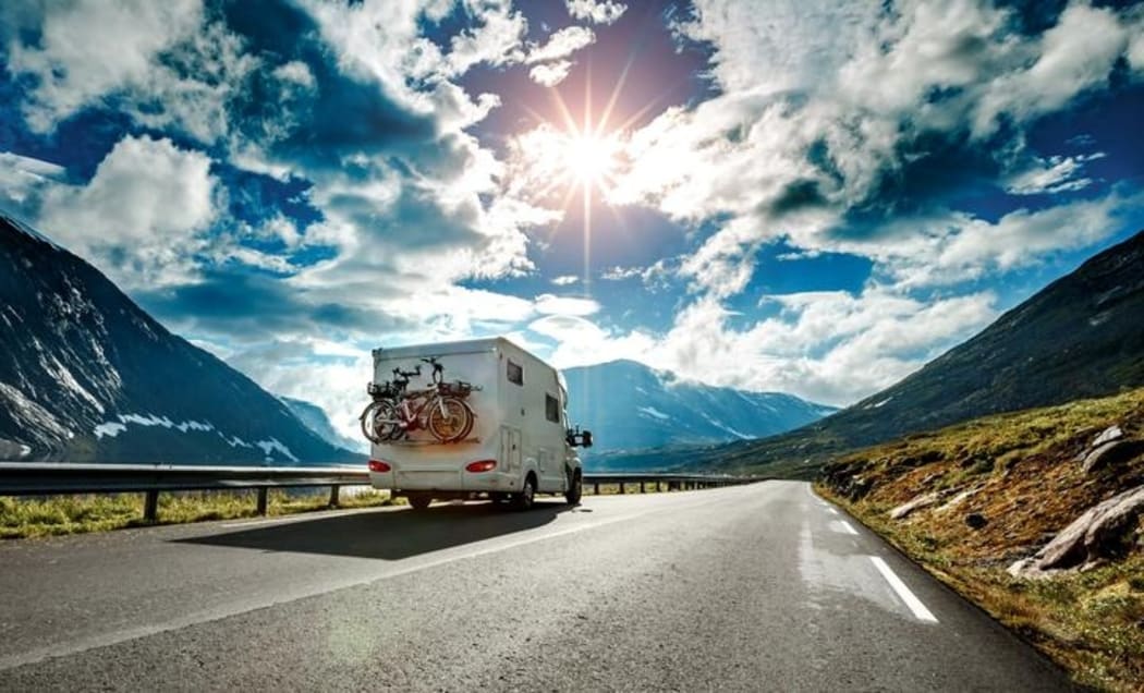 Caravan car travels on the highway.