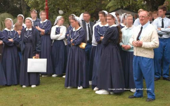 Members of Gloriavale commune at a gathering. Founding member Hopeful Christian stands on the right.