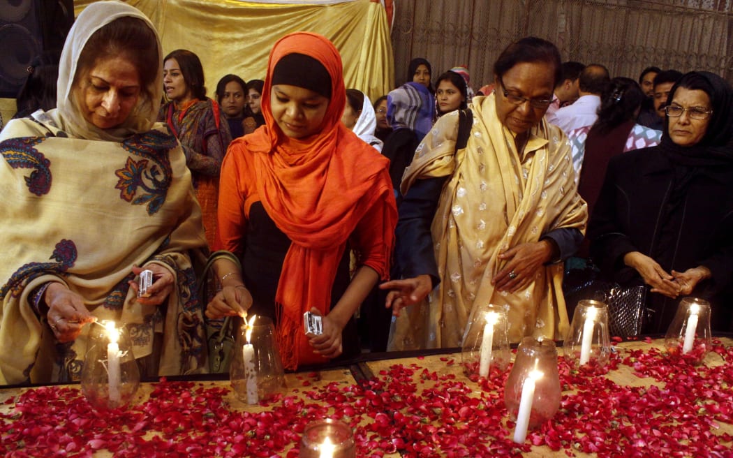 A candle-lit vigil was held in Karachi in memory of the victims of the Taliban assault on a Peshawar school.