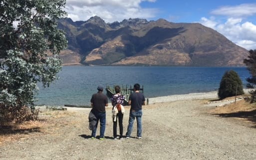 Tyler Nii’s parents and brother looking out over Lake Wakatipu.