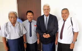 Faamausili Moli Malietoa (second from right) with matais of Malie outside the court room