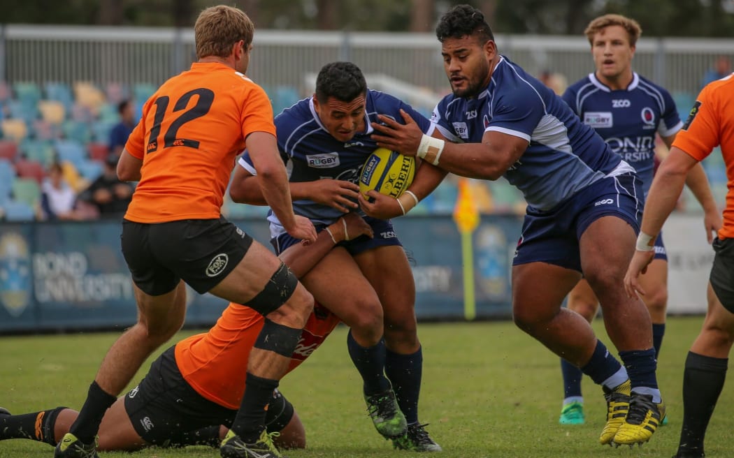 Sef Fa'agase takes the ball into contact.