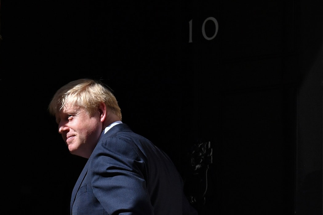 Britain's Prime Minister Boris Johnson turns outside 10 Downing Street in July 2109.