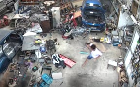 Screen grab from CCTV footage inside a garage of the moment a quake strikes in Port Vila, Vanuatu on 17 November , 2024