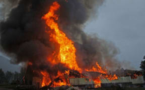 farm buildings ablaze