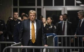 Former US President and Republican presidential candidate Donald Trump arrives to speak to the press at the end of the day's proceedings in his criminal trial at Manhattan Criminal Court in New York City, on May 21, 2024. Donald Trump's defense lawyers rested their case Tuesday -- without the former president following through on a vow to testify -- as the judge planned jury deliberations in the historic criminal trial for early next week. (Photo by Dave Sanders / POOL / AFP)