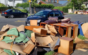 Auckland flooding - piles of rubbish on Shackleton Road in Mt Eden
