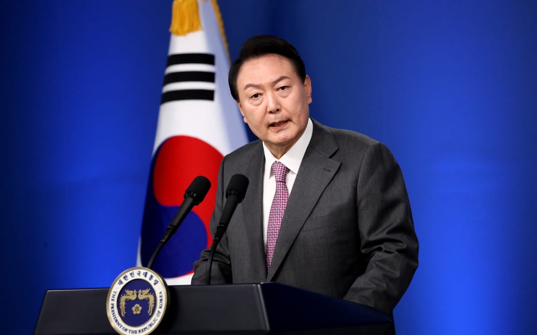 South Korean President Yoon Suk-yeol delivers a speech during his news conference to mark his first 100 days in office at the presidential office in Seoul on August 18.