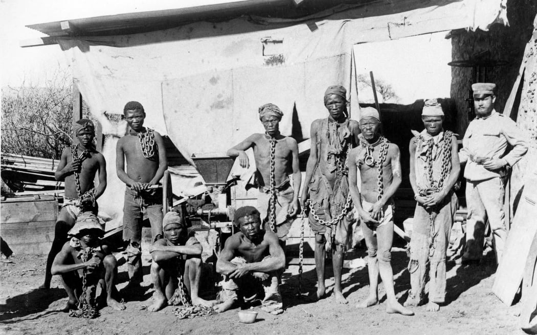 This undated file photo taken during the 1904-1908 war of Germany against Herero and Nama in Namibia shows a soldier (R) probably belonging to the German troops supervising Namibian war prisoners.
