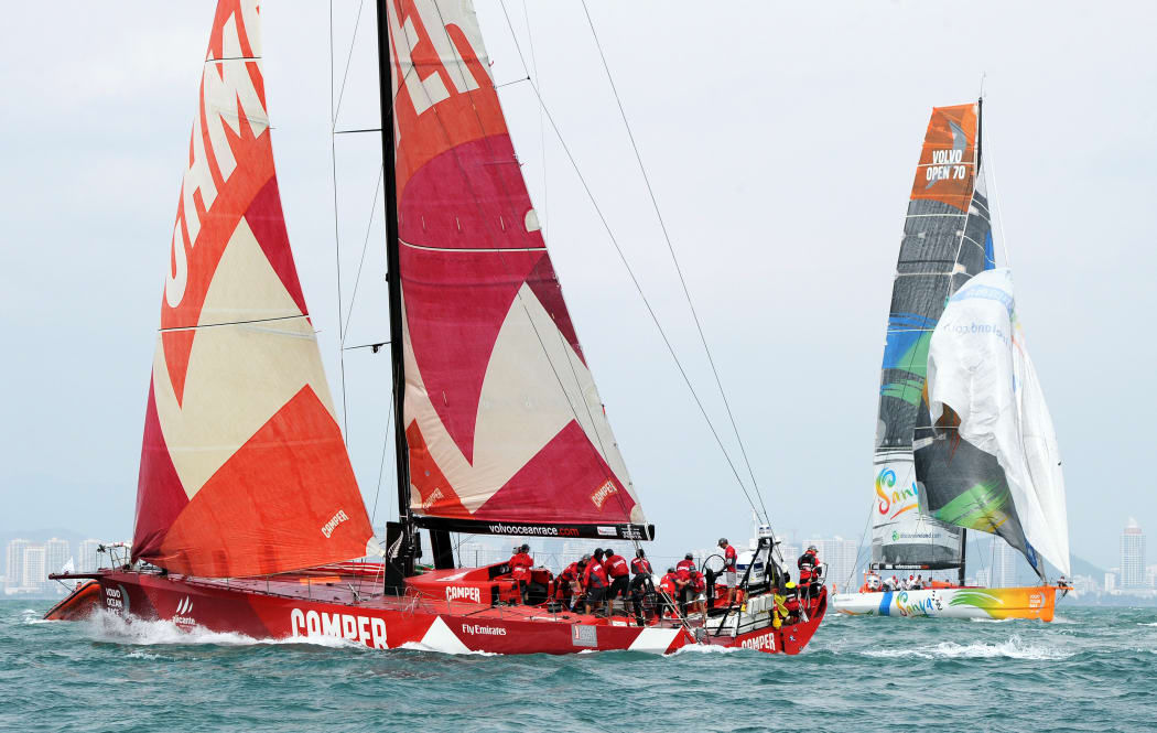 The Camper Team New Zealand yacht (L) sails in an in-port-race during a Chinese stopover  last year.