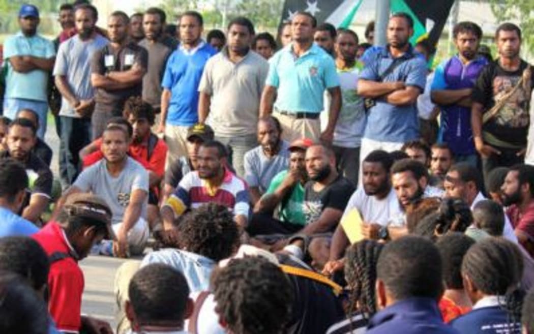 UPNG students meet on campus.