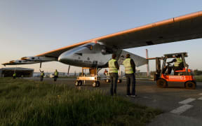 The carbon-fibre aircraft has a wingspan wider than a Boeing jet, but weighs only 2.3 tonnes.