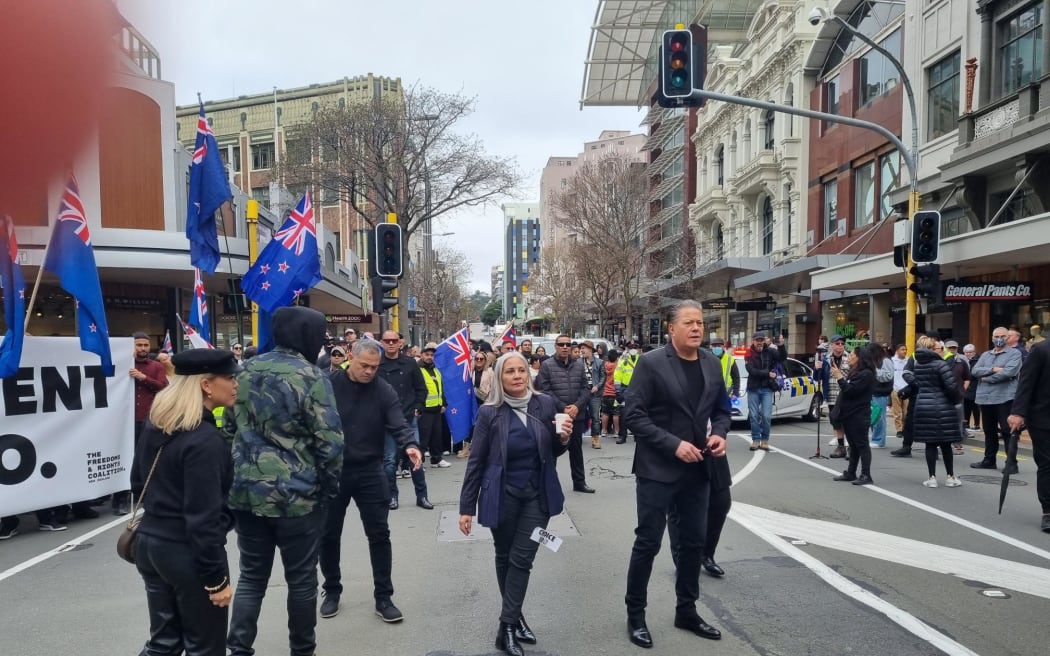 Brian and Hannah Tamaki seen during the anti-government protest in Wellington, marching towards Parliament on 23 August 2022.