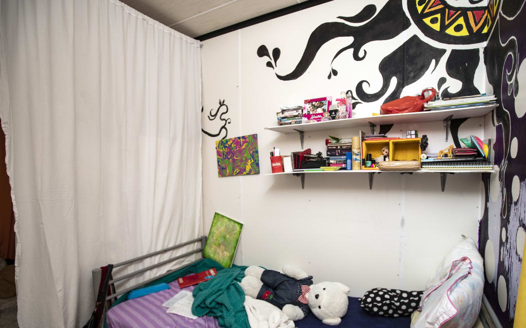The bedroom of 15-year-old refugee Helia, in the Nibok refugee settlement. She spends all her time here, and has installed a sheet to provide some privacy in a tiny space from her 22 year old sister.