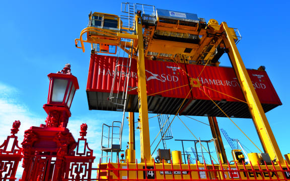 Straddle carriers and containers on Fergusson Wharf at Ports of Auckland.