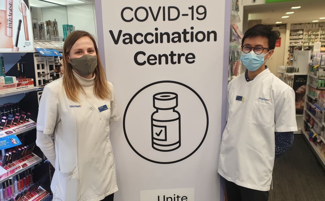 Lambton Quay Unichem Pharmacy vaccinator Georgia Lidstone, left, and business manager and pharmacist Victor Chong
