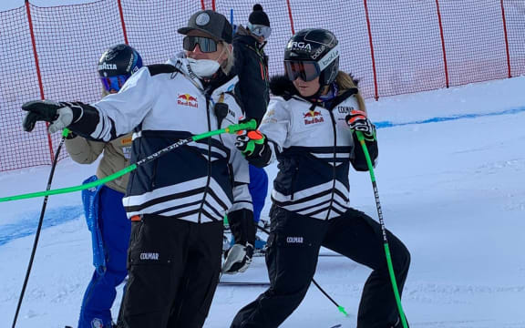 Alice Robinson inspecting the course with coach Chris Knight earlier in the week at the FIS Ski World Championships being held in Cortina. Credit: Enrica Cipriana