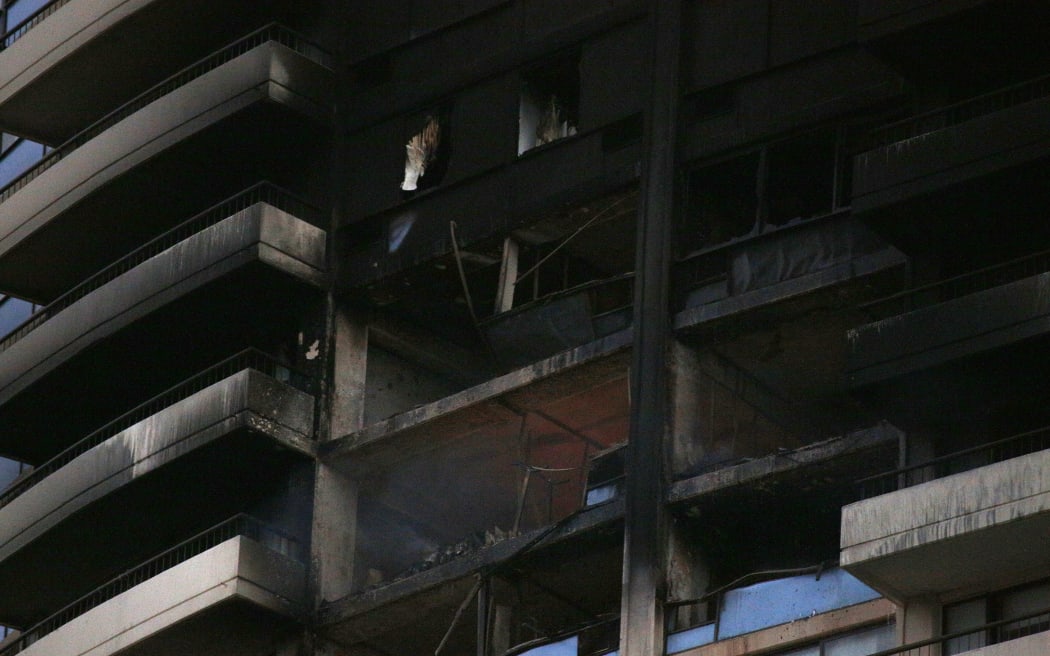 A close-up view of the damage after the fire at the Marco Polo high-rise building in Honolulu.