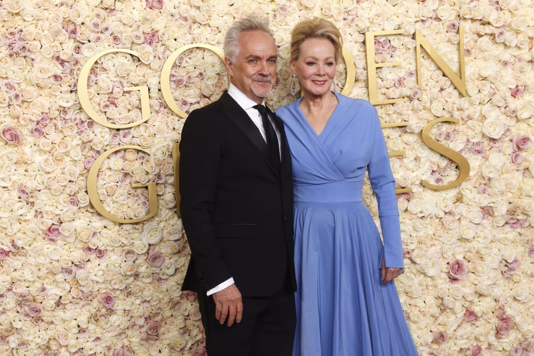 US actress Jean Smart (R) and Joe Pacheco arrive for the 82nd annual Golden Globe Awards at the Beverly Hilton hotel in Beverly Hills, California, on January 5, 2025.