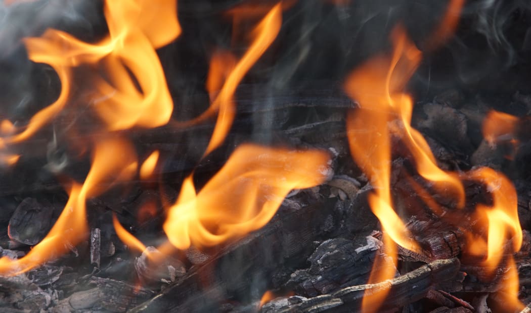 fire flame smoke embers to fry on the street close-up