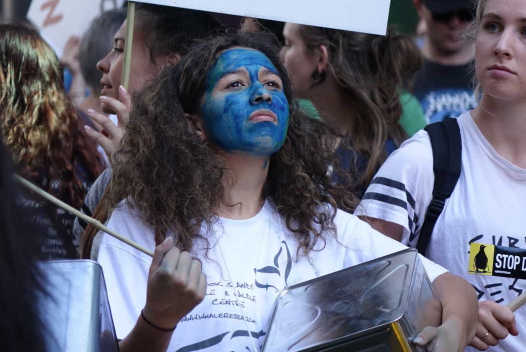 Protestors march in Auckland against deep-sea drilling.