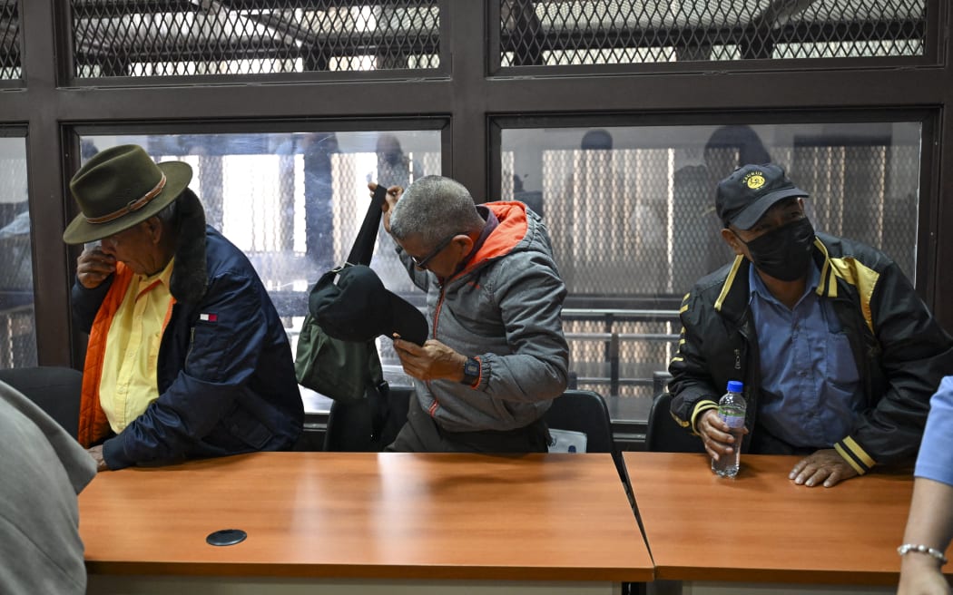 EDITORS NOTE: Graphic content / Former paramilitaries Simeon Enriquez (L), Pedro Sanchez (C), and Felix Tum react after being sentenced to 40 years in prison for crimes of sexual violence against six Mayan women from the Achi community of Rabinal during the civil war in Guatemala (1960-1996), at the courtroom in Guatemala City on May 30, 2025. The three former paramilitaries, also indigenous, were members of the Civil Self-Defense Patrols, created by the Armed Forces to fight the leftist guerrillas during the war that left 200,000 dead and missing, according to the UN. (Photo by JOHAN ORDONEZ / AFP)
