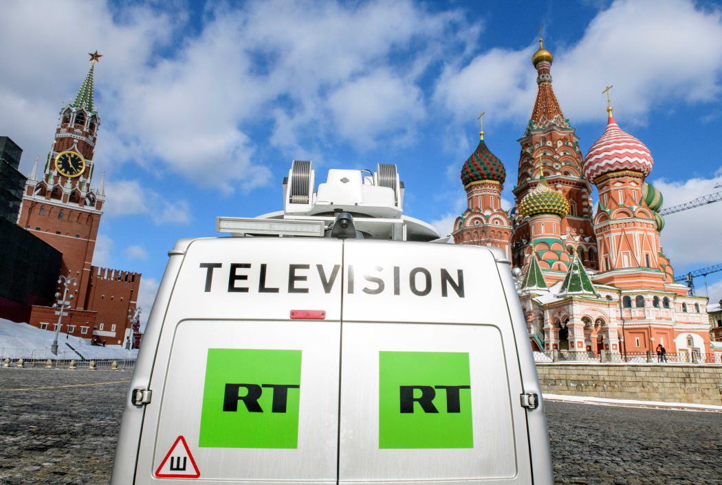 A Russia's state-controlled Russia Today (RT) television broadcast van is seen parked in front of St. Basil's Cathedral.