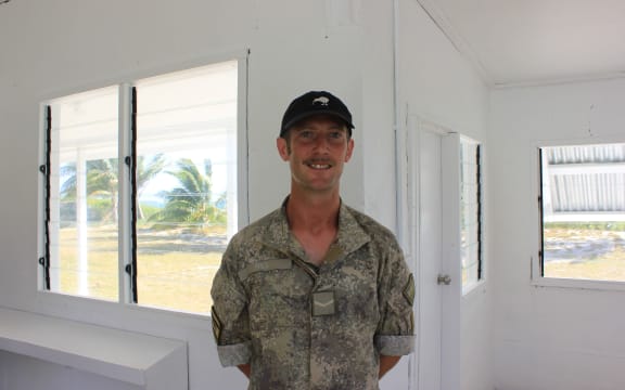 New Zealand soldier Lance Corporal Aaron Hill standing in a preschool refurbished as part of Exercise Tropic Twilight.