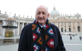 Australia's ambassador to the Holy See Tim Fischer poses on February 19, 2010 in front of St Peter's Basilica, after Pope Benedict XVI announced that Australia will have its first Roman Catholic saint
